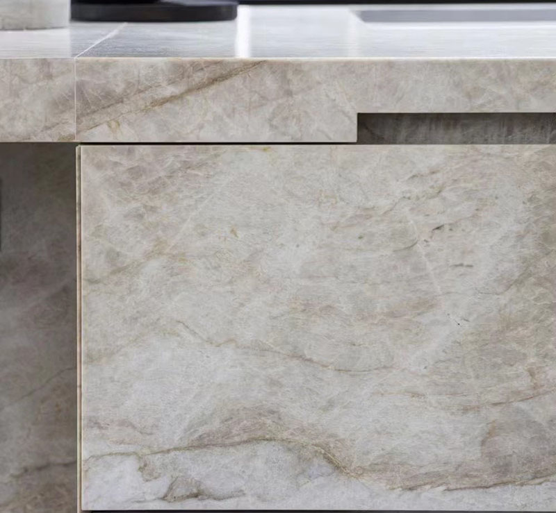 Close-up texture of premium Taj Mahal Quartzite slab with gold veining..jpg